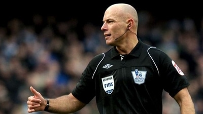 Referee Howard Webb gestures during a Premier League match. Referee Howard Webb gestures during a Premier League match.