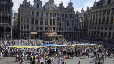 A giant Ukrainian flag is unfurled during an event for Ukrainian Independence Day in the historical Grand Place of Brussels. (AP) A giant Ukrainian flag is unfurled during an event for Ukrainian Independence Day in the historical Grand Place of Brussels. (AP)