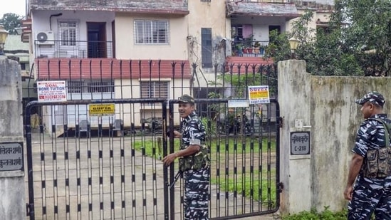 Ranchi: Central Reserve Police Force personnel stand guard during a raid by ED at a premises linked to a close aide of Jharkhand CM Hemant Soren. Ranchi: Central Reserve Police Force personnel stand guard during a raid by ED at a premises linked to a close aide of Jharkhand CM Hemant Soren.