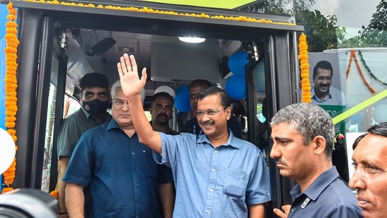 Delhi Chief Minister Arvind Kejriwal and Delhi Transport Minister Kailash Gahlot during a ceremony to launch 97 electric buses, at Rajghat Bus Depot in Delhi.(PTI)