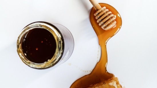 Honey: Apply honey directly to the ulcers and make sure to keep reapplying every few hours for better results. The antimicrobial properties in honey can aid in repairing any open wound quickly.(Unsplash)