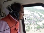 Madhya Pradesh Chief minister Shivraj Singh Chouhan conducts an aerial survey of the flood-affected Vidisha district on Tuesday, August 23.(ANI)