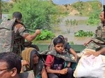Visual from rescue operations conducted by Army in 80 flood-affected villages of Rajasthan as Chambal river started flowing above the danger mark in Dholpur.(ANI/Twitter) Visual from rescue operations conducted by Army in 80 flood-affected villages of Rajasthan as Chambal river started flowing above the danger mark in Dholpur.(ANI/Twitter)