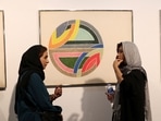 Visitors look at Sinjerli Variations I-V, by American painter Frank Stella made in 1977.(AFP)