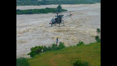 An Army helicopter airlifting a farmer stuck in Betwa river in Jhansi district of U.P. on Thursday. (Sourced) An Army helicopter airlifting a farmer stuck in Betwa river in Jhansi district of U.P. on Thursday. (Sourced)