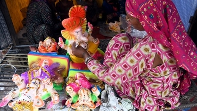 An artist gives final touch to idols of Lord Ganesh at a workshop ahead of the Ganesh Chaturthi festival in Delhi. (ANI) An artist gives final touch to idols of Lord Ganesh at a workshop ahead of the Ganesh Chaturthi festival in Delhi. (ANI)