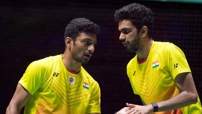 M.R. Arjun, left, and Dhruv Kapila of India compete in men's doubles against Kim Astrup and Anders Skaarup Rasmussen of Denmark in the BWF World Championships. (AP)
