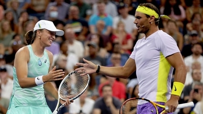 Iga Swiatek and Rafael Nadal celebrate a point against John McEnroe and Coco Gauff during Tennis Plays For Peace exhibition matches to benefit Ukraine at USTA Billie Jean King National Tennis Center (AFP)
