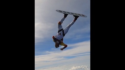The image, taken from the Instagram video, shows a man doing helicopter spins while skysurfing. (Instagram/@guinnessworldrecords)
