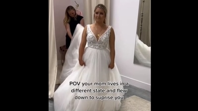 The image, taken from the viral Instagram video, shows the daughter looking at her mom while wearing a wedding gown. (Instagram/@devancwilliamson)
