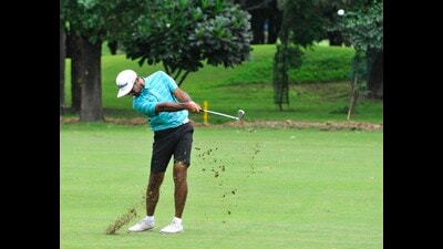 A player in action during the Samarvir Sahi Golf Championship being held at the Chandigarh Golf Club greens. (HT)