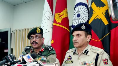 Rajouri SSP M Aslam with a senior army officer addressing a press conference in Rajouri over foiling infiltration bids at LoC on Wednesday. (ANI)