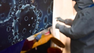 An illustration of the novel coronavirus seen next to a health care worker at a Covid-19 testing centre. (Sanchit Khanna / HT Photo) An illustration of the novel coronavirus seen next to a health care worker at a Covid-19 testing centre. (Sanchit Khanna / HT Photo)