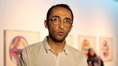 Behrang Samadzadegan, curator of the "Minimalism and Conceptual Art" exhibition, which showcases works from the 19th and 20th-centuries by American and European artists, speaks during an interview. (AFP)