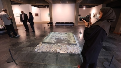 A visitor looks at an installation by American artist Robert Smithson, associated with the Land Art movement. The current "Minimalism and Conceptual Art" exhibition features 132 works by 34 world-famous contemporary artists. (AFP)
