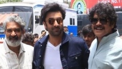 SS Rajamouli poses with Brahmastra stars Ranbir Kapoor and Nagarjuna at a promotional event in Chennai.