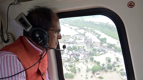 Madhya Pradesh Chief minister Shivraj Singh Chouhan conducts an aerial survey of the flood-affected Vidisha district on Tuesday, August 23.(ANI) Madhya Pradesh Chief minister Shivraj Singh Chouhan conducts an aerial survey of the flood-affected Vidisha district on Tuesday, August 23.(ANI)