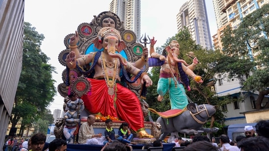 On this day, devotees bring home idols of Lord Ganesh, offer prayers and bhog for 10 days then immerse the idols in some water body.(AFP)