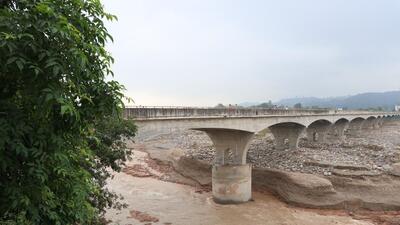 The highway bridge runs parallel to the colonial-era railway bridge that was washed away in the flood. Illegal mining in the Chakki rivulet is said to be the main reason behind the damage to the bridges. (HT Photo) The highway bridge runs parallel to the colonial-era railway bridge that was washed away in the flood. Illegal mining in the Chakki rivulet is said to be the main reason behind the damage to the bridges. (HT Photo)
