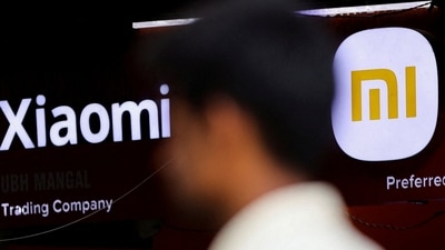 REUTERS: A man walks past a logo of Xiaomi, a Chinese manufacturer of consumer electronics, outside a shop in Mumbai, India, May 11, 2022. (Image used only for representation)