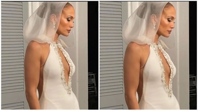 Ralph Lauren created the bride’s three custom gowns with love, care, and consideration woven into every detail of the silhouettes. Modern heirlooms for a timeless romance. Drawing inspiration from archival Ralph Lauren pieces, Jennifer Lopez’s custom handkerchief wedding gown reimagines a turtleneck column dress with the addition of a dramatic ruffle hem. (Courtesy of OntheJLo.com) Ralph Lauren created the bride’s three custom gowns with love, care, and consideration woven into every detail of the silhouettes. Modern heirlooms for a timeless romance. Drawing inspiration from archival Ralph Lauren pieces, Jennifer Lopez’s custom handkerchief wedding gown reimagines a turtleneck column dress with the addition of a dramatic ruffle hem. (Courtesy of OntheJLo.com)