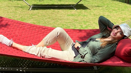 In a picture, Raveena lay in a red hammock in the garden and smiled for the camera. She wore a T-shirt under an olive green shirt and beige pants. Another photo showed her inside a forest.