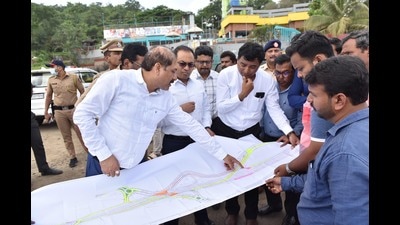 PMC commissioner Vikram Kumar (left), along with other government officials, observes the Chandni chowk map, to come with solutions for traffic chaos. (Ravindra Joshi/HT PHOTO)