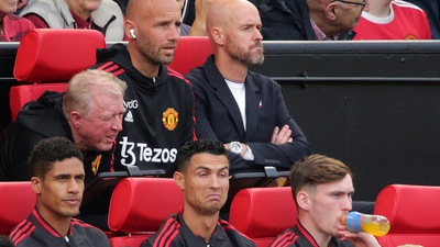 Manchester United' Cristiano Ronaldo, centre, gestures as he sits with teammates, prior to the start of a Premier League match. (AP) Manchester United' Cristiano Ronaldo, centre, gestures as he sits with teammates, prior to the start of a Premier League match. (AP)