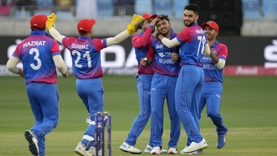 Afghanistan's Fazalhaq Farooqi, center, celebrates with teammates after taking the wicket of Sri Lanka's Kusal Mendis during the T20 cricket match of Asia Cup (AP) Afghanistan's Fazalhaq Farooqi, center, celebrates with teammates after taking the wicket of Sri Lanka's Kusal Mendis during the T20 cricket match of Asia Cup (AP)