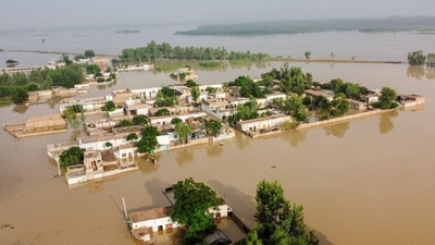 A general view of a flooded area after heavy monsoon rains is pictured from atop a bridge in Charsadda district in the Khyber Pakhtunkhwa province of Pakistan on August 27, 2022. (Photo by Abdul MAJEED / AFP) (AFP) A general view of a flooded area after heavy monsoon rains is pictured from atop a bridge in Charsadda district in the Khyber Pakhtunkhwa province of Pakistan on August 27, 2022. (Photo by Abdul MAJEED / AFP) (AFP)