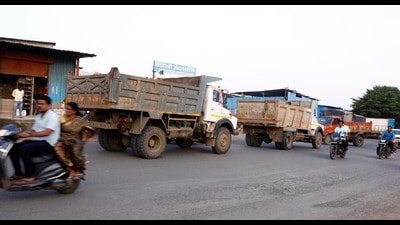 Heavy vehicles at Gangadham road on Saturday. (Rahul Raut/HT PHOTO)
