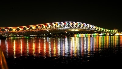Ahmedabad: Atal Bridge over Sabarmati river illuminated with lights on the eve of its inauguration, in Ahmedabad, Friday, Aug. 26, 2022. (PTI) Ahmedabad: Atal Bridge over Sabarmati river illuminated with lights on the eve of its inauguration, in Ahmedabad, Friday, Aug. 26, 2022. (PTI)
