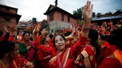The first day of Teej is known as 'Dar Khane Din' where women in bright red traditional attires assemble at one place and sing folk songs and dance. On this day, devotees prepare a special dish called 'dar' and enjoy a grand feast with friends and family. (Reuters) The first day of Teej is known as 'Dar Khane Din' where women in bright red traditional attires assemble at one place and sing folk songs and dance. On this day, devotees prepare a special dish called 'dar' and enjoy a grand feast with friends and family. (Reuters)