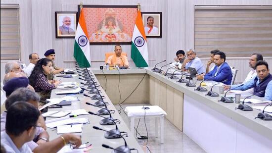 Uttar Pradesh chief minister Yogi Adityanath at a meeting in Lucknow on Saturday. (PTI PHOTO)