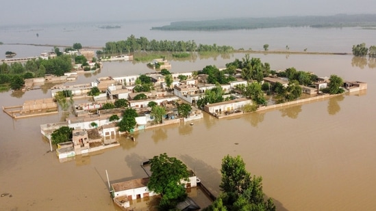 A general view of a flooded area after heavy monsoon rains is pictured from atop a bridge in Charsadda district in the Khyber Pakhtunkhwa province of Pakistan on August 27, 2022. (Photo by Abdul MAJEED / AFP)(AFP)