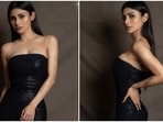 One can always trust Mouni Roy to bring her best fashion foot forward, whether she is doing photoshoots, enjoying casual date nights or walking red carpets at star-studded events. One look at Mouni's Instagram page, and you will believe us too. Even her latest post gives you a glimpse of her glam sartorial picks. She slipped into a black embellished bodycon gown that is a perfect pick for attending your best friend's wedding bash.(Instagram/@imouniroy)