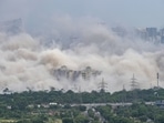 Dust covers the area after demolition of Supertech's twin towers in Noida on Sunday, August 28, 2022. (PTI Photo/Atul Yadav) Dust covers the area after demolition of Supertech's twin towers in Noida on Sunday, August 28, 2022. (PTI Photo/Atul Yadav)