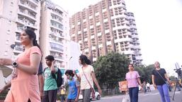 People vacating the area ahead of the demolition of Supertech twin towers in Noida on Sunday. (PTI)