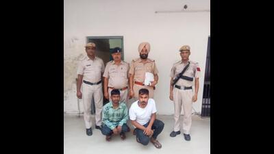 Two of the suspects in custody of the Ambala police. The other two, who suffered bullet injuries, are in the hospital. (HT Photo)