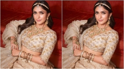 Mrunal wore a part of her tresses into a ponytail and left the rest of the tresses open in soft wavy curls. (Instagram/@mrunalthakur)
