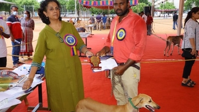 A dog participating in the event receives a participation prize from the judge. (source: students from Veterinary College and Research Institute, Theni) A dog participating in the event receives a participation prize from the judge. (source: students from Veterinary College and Research Institute, Theni)