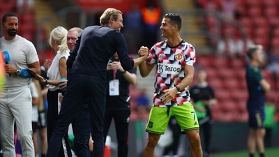 Manchester United's Cristiano Ronaldo shakes hands with Peter Crouch. (REUTERS)