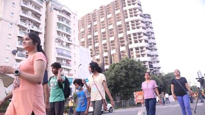People vacating the area ahead of the demolition of Supertech twin towers in Noida on Sunday. (PTI) People vacating the area ahead of the demolition of Supertech twin towers in Noida on Sunday. (PTI)
