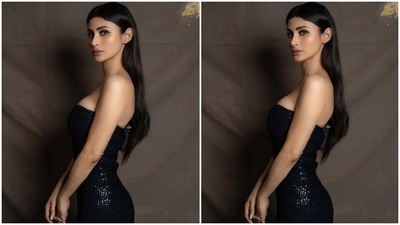 Mouni glammed up her must-have party look by leaving her long mane open in a centre parting, and for the glam picks, she chose black winged eyeliner, matte nude lip shade, shimmering eye shadow, dewy base, mascara on the lashes, bronzer and blush on the cheeks, and sharp contouring. (Instagram/@imouniroy) Mouni glammed up her must-have party look by leaving her long mane open in a centre parting, and for the glam picks, she chose black winged eyeliner, matte nude lip shade, shimmering eye shadow, dewy base, mascara on the lashes, bronzer and blush on the cheeks, and sharp contouring. (Instagram/@imouniroy)