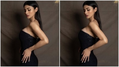 Mouni's strapless black gown features shimmering black sequin embellishments - placed all over the fabric. Additionally, the A-line silhouette of the skirt, the short train at the back, and the floor-sweeping hem length rounded off the design details of the ensemble. Lastly, the bodycon fitting accentuated the star's enviable curves. (Instagram/@imouniroy) Mouni's strapless black gown features shimmering black sequin embellishments - placed all over the fabric. Additionally, the A-line silhouette of the skirt, the short train at the back, and the floor-sweeping hem length rounded off the design details of the ensemble. Lastly, the bodycon fitting accentuated the star's enviable curves. (Instagram/@imouniroy)