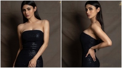 One can always trust Mouni Roy to bring her best fashion foot forward, whether she is doing photoshoots, enjoying casual date nights or walking red carpets at star-studded events. One look at Mouni's Instagram page, and you will believe us too. Even her latest post gives you a glimpse of her glam sartorial picks. She slipped into a black embellished bodycon gown that is a perfect pick for attending your best friend's wedding bash. (Instagram/@imouniroy) One can always trust Mouni Roy to bring her best fashion foot forward, whether she is doing photoshoots, enjoying casual date nights or walking red carpets at star-studded events. One look at Mouni's Instagram page, and you will believe us too. Even her latest post gives you a glimpse of her glam sartorial picks. She slipped into a black embellished bodycon gown that is a perfect pick for attending your best friend's wedding bash. (Instagram/@imouniroy)