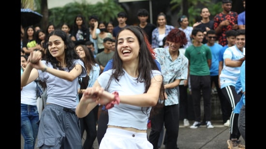Students dance in a flash mob on Marine Drive