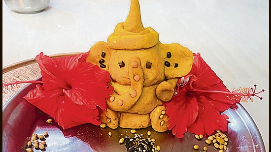 Gurugram-based artist Gurpreet Soni’s idol, representing the nine planets, is made using haldi, ghee, dhaniya seeds and dal. Gurugram-based artist Gurpreet Soni’s idol, representing the nine planets, is made using haldi, ghee, dhaniya seeds and dal.
