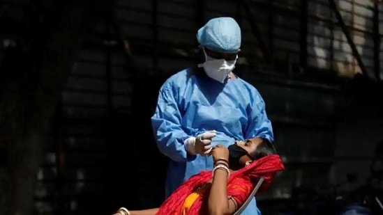 A health worker taking a nose swab of a patient for Covid test.(File photo for representation)