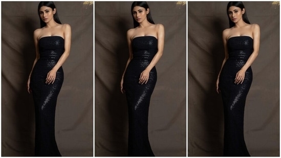 On Sunday, Mouni took to Instagram to drop pictures from a new photoshoot. It showed the Brahmastra actor embracing glamour and sass while serving stunning poses for the camera. She slipped into a black strapless gown from the shelves of designer Rudraksh Dwivedi's clothing label. Keep scrolling to check out Mounis' photos from the shoot.(Instagram/@imouniroy)